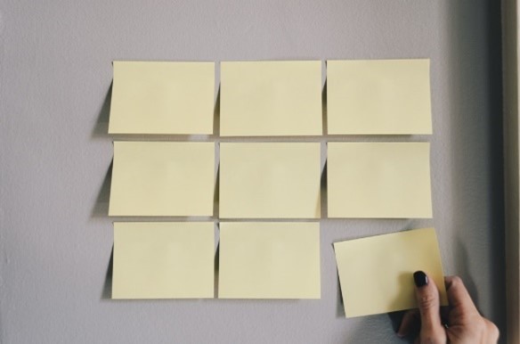 9 Sticky notes on a wall.